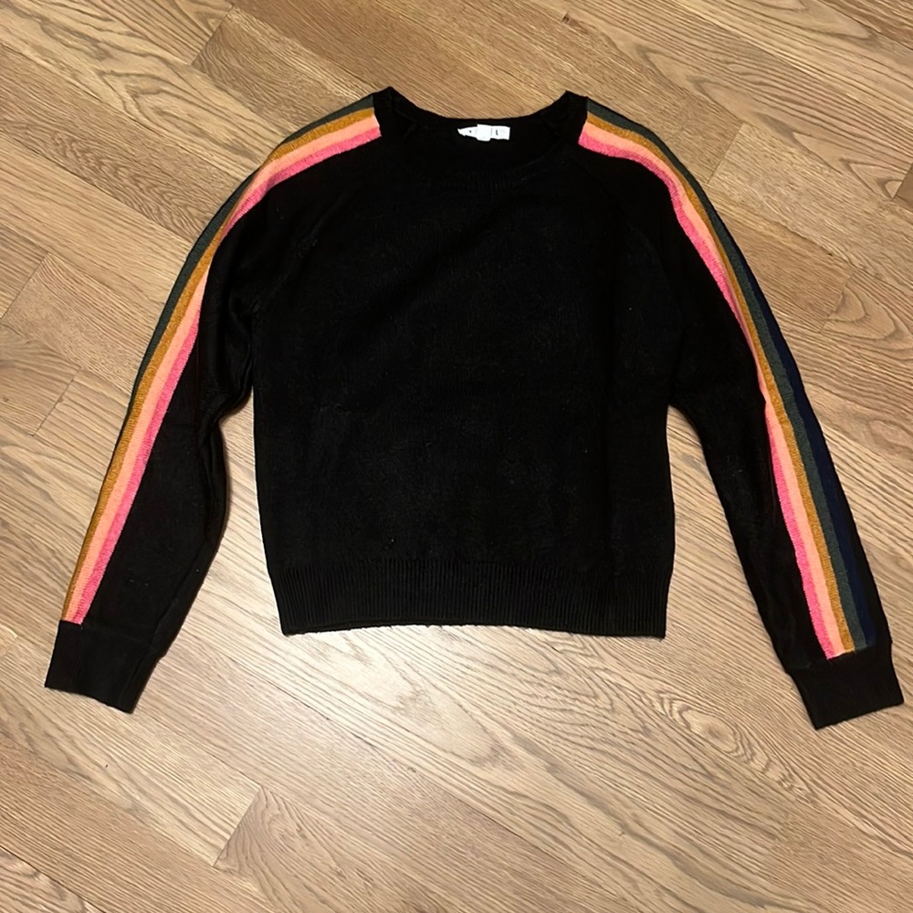 Black sweater with striped sleeves